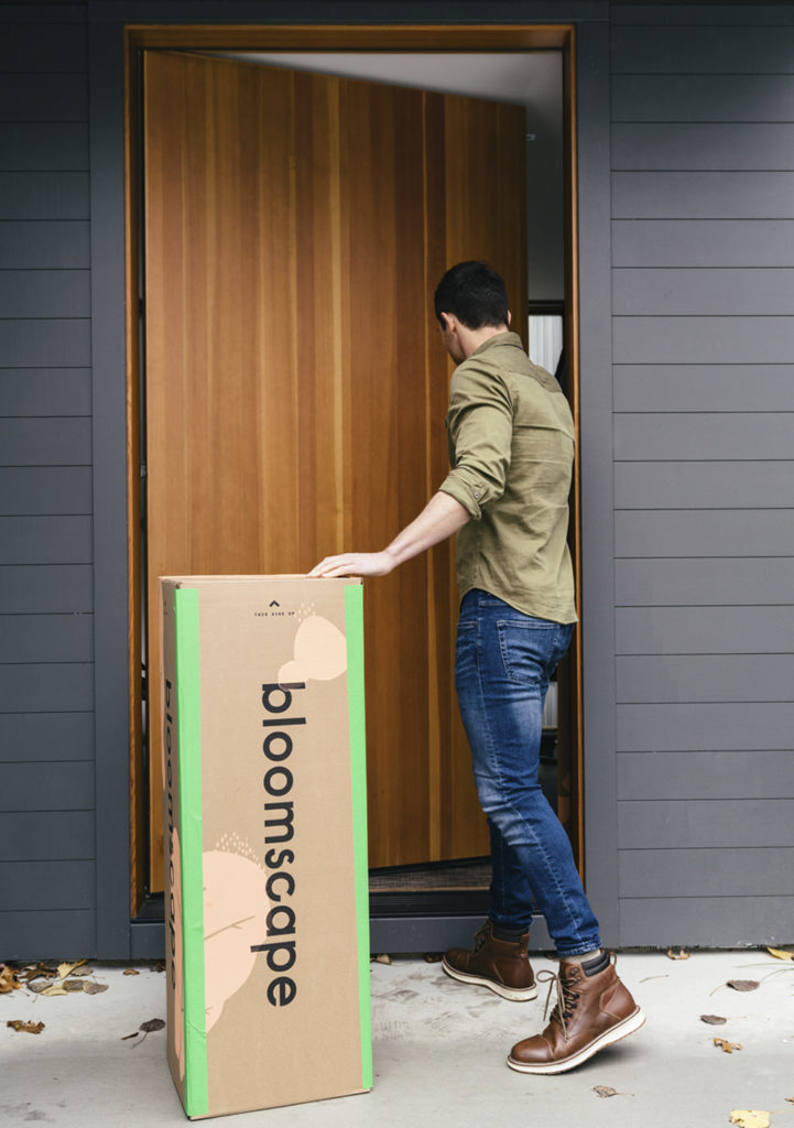man with bloomscape box