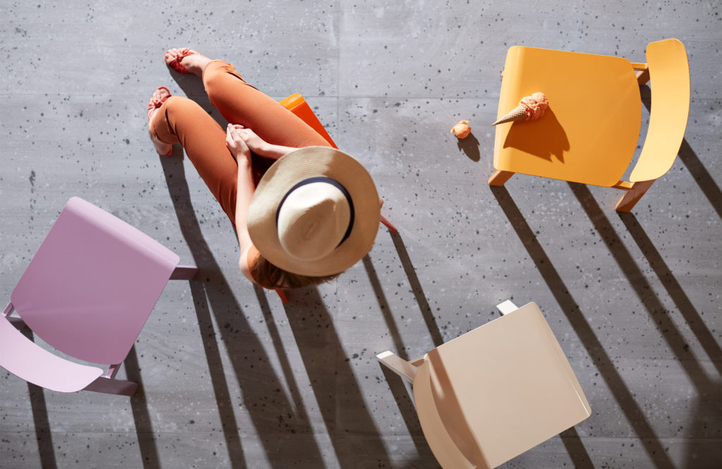 Woman and colorful chairs