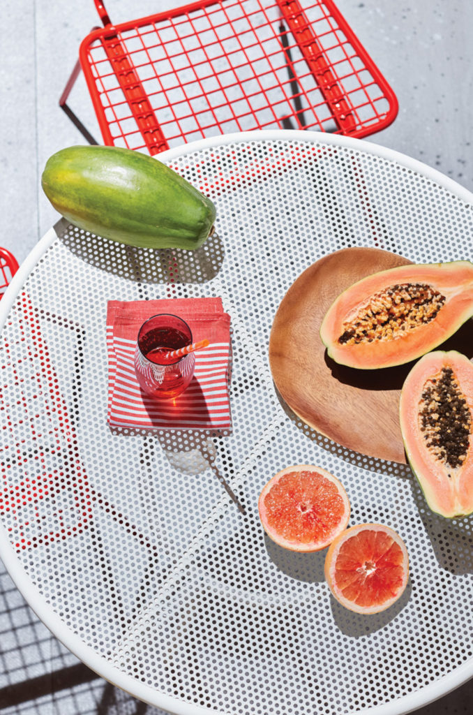 Papaya and fruits on table