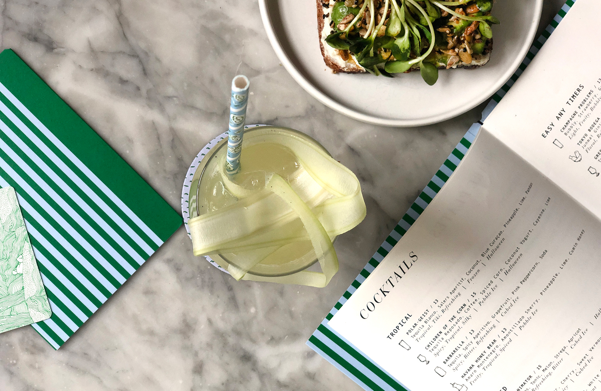 A cocktail and menus at Sunday in Brooklyn