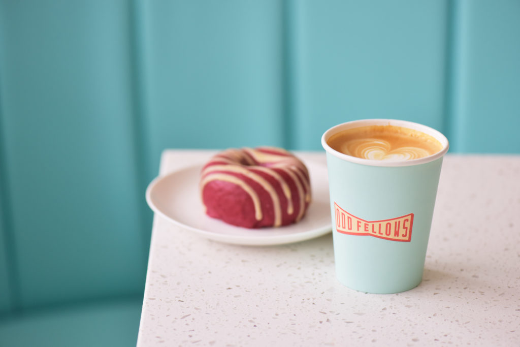 a latte and colorful donut